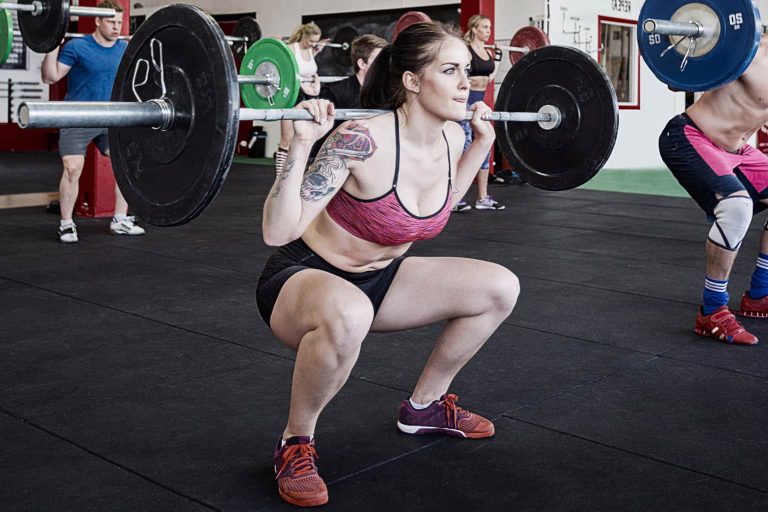 Woman Lifting a Barbell